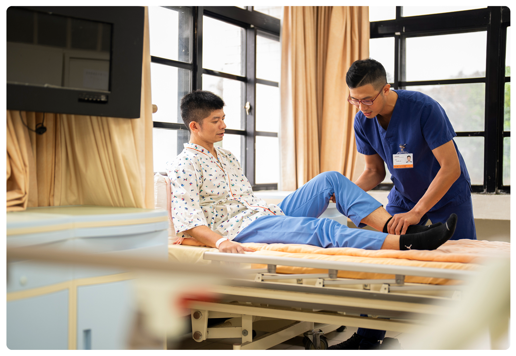 Patient receives leg therapy from healthcare professional.